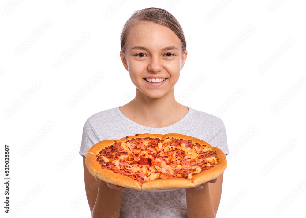 Happy beautiful young teen girl holds plate with fresh pizza. Portrait of child with delicious Italian pizza, isolated on white background. Girl looks at camera and smiling. Happy beautiful young teen girl holds plate with fresh pizza. Portrait of child with delicious Italian pizza, isolated on white background. Girl looks at camera and smiling.