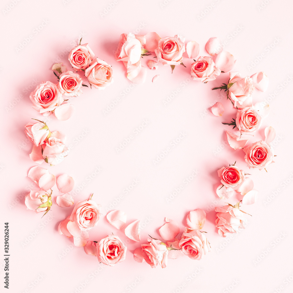 Flowers composition. Wreath made of rose flowers on pink background. Valentines day, mothers day, womens day concept. Flat lay, top view, copy space