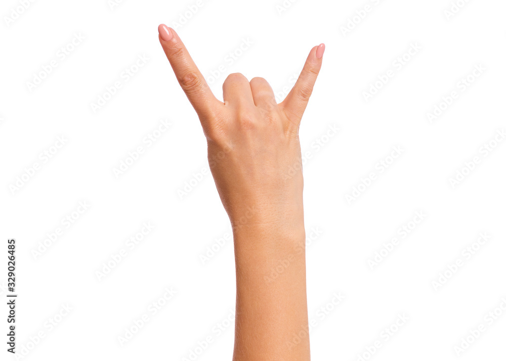 Female hand showing heavy metal Rock gesture, isolated on white background. Beautiful hand of woman with copy space. Hand pointing two fingers. Female hand showing heavy metal Rock gesture, isolated on white background. Beautiful hand of woman with copy space. Hand pointing two fingers.