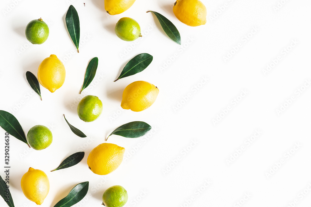 Lemon and lime fruits on white background. Flat lay, top view - obrazy, fototapety, plakaty 