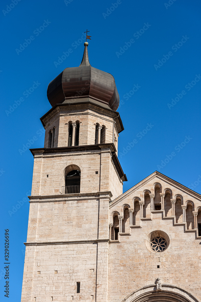 Closeup of San Vigilio Cathedral (Duomo di Trento, 1212-1321) with the bell tower and facade in Romanesque style, Trento downtown, Trentino-Alto Adige, Italy, Europe