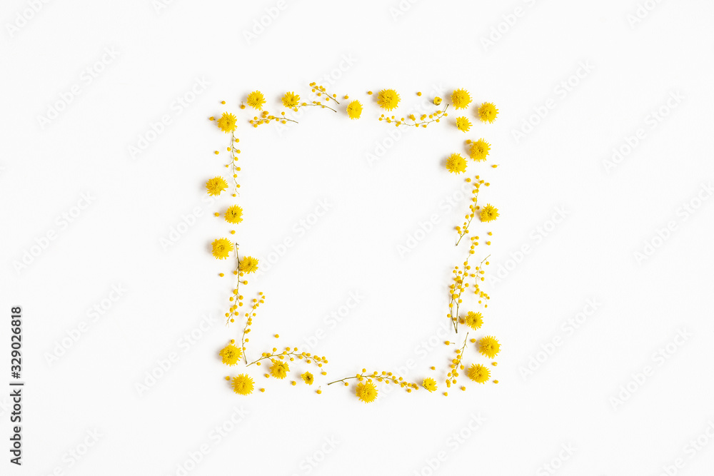 Flowers composition. Frame made of yellow flowers on white background. Spring concept. Flat lay, top view
