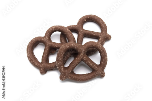 Pretzel with Chocolated biscuit flavored and coated chocolated cream on white background.