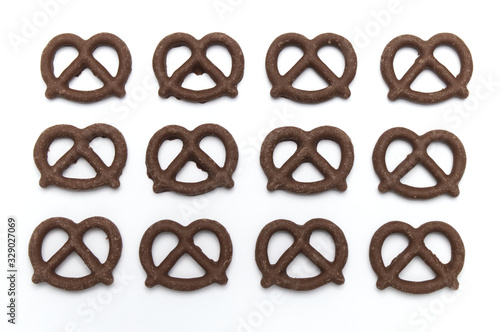 Pretzel with Chocolated biscuit flavored and coated chocolated cream on white background.
