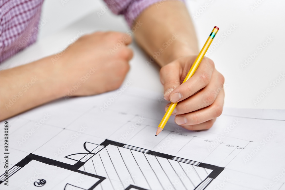 business, architecture and people concept - close up of architect's hand working with blueprint and pencil business, architecture and people concept - close up of architect's hand working with blueprint and pencil
