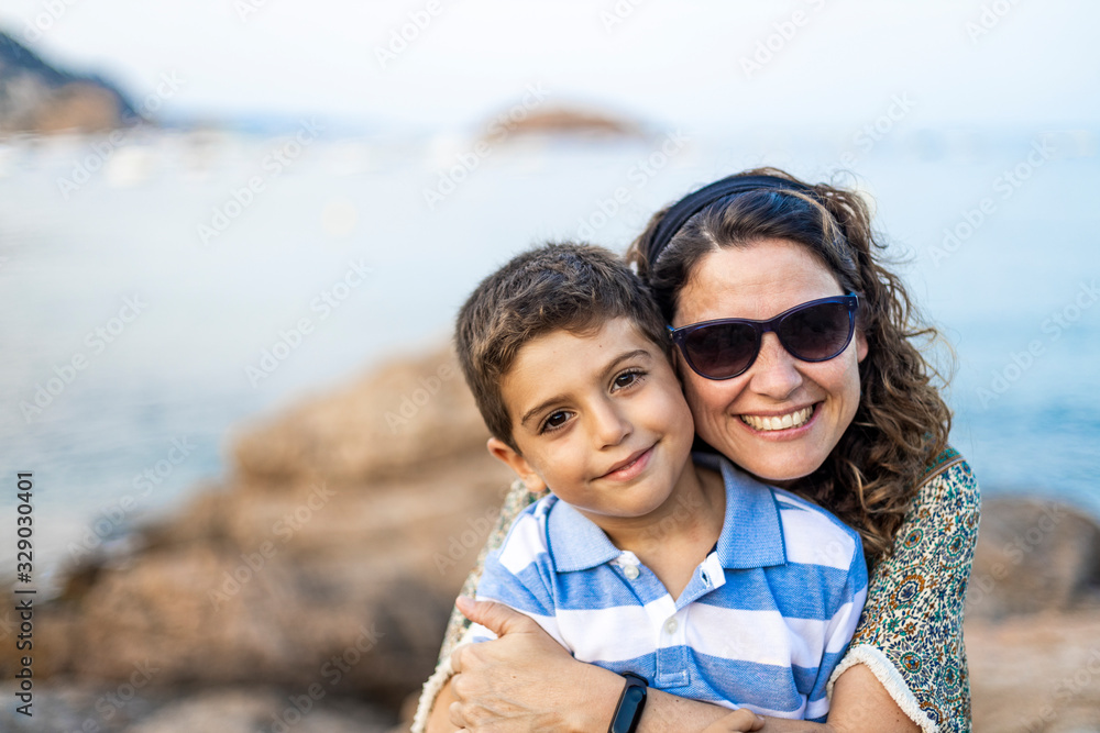 Portrait of mother and son in a rocky coast