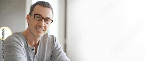 Template portrait of smiling middle-aged man with eyeglasses