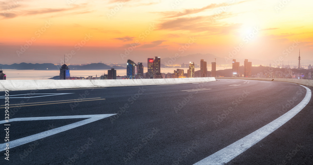 Asphalt road and Qingdao urban construction skyline.. Asphalt road and Qingdao urban construction skyline..
