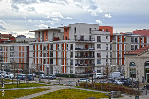 Saint-Etienne, France - January 27th 2020 : White and red brick modern tenements in the city, near the City of Design.