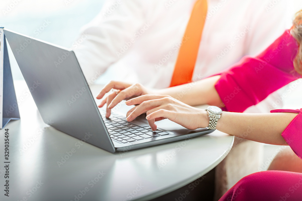 Businesswoman using a laptop on her desk Businesswoman using a laptop on her desk