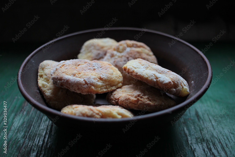 Healthy natural homemade cookies in ceramic bowl on dark rustic wooden background Healthy natural homemade cookies in ceramic bowl on dark rustic wooden background