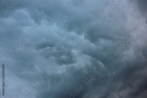 Blurred dramatic sky background. Exciting dark stormy clouds before rain