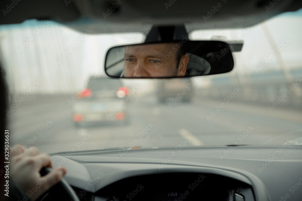 Fototapeta premium the driver of the car is going to look at the road