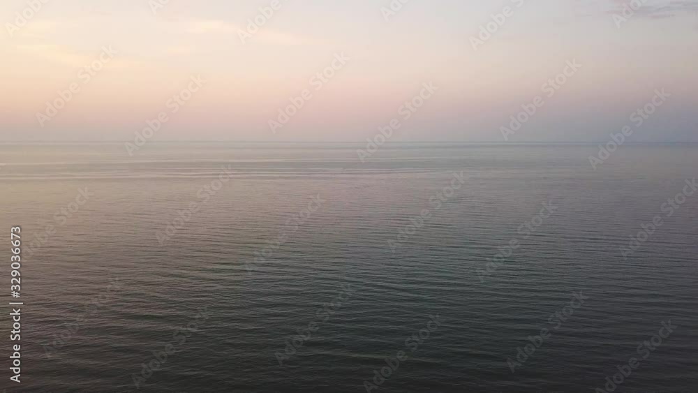 Aerial view of a Sunrise sky background. Aerial Dramatic gold sunrise with morning sky clouds over the sea. Stunning sky clouds in the sunrise. Aerial videography. 4K. Aerial view of a Sunrise sky background. Aerial Dramatic gold sunrise with morning sky clouds over the sea. Stunning sky clouds in the sunrise. Aerial videography. 4K.