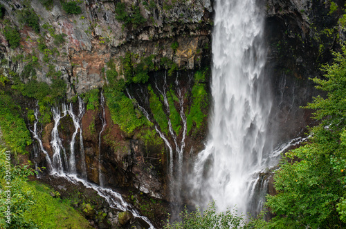 Close up of massive waterfall stream. Waterfall nature background