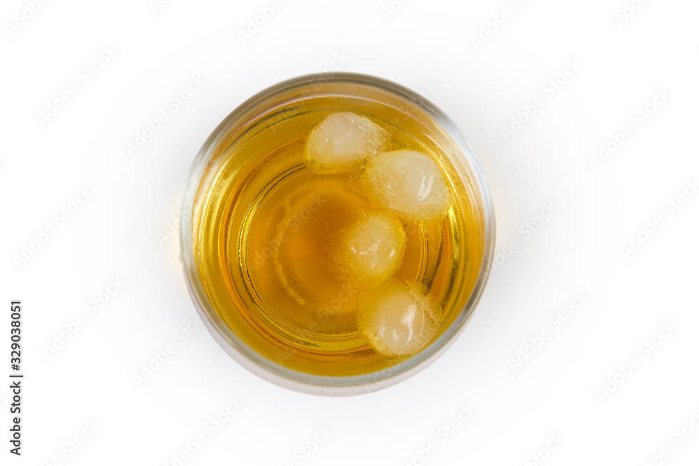 Top view of glass of whisky with ice on white background Top view of glass of whisky with ice on white background