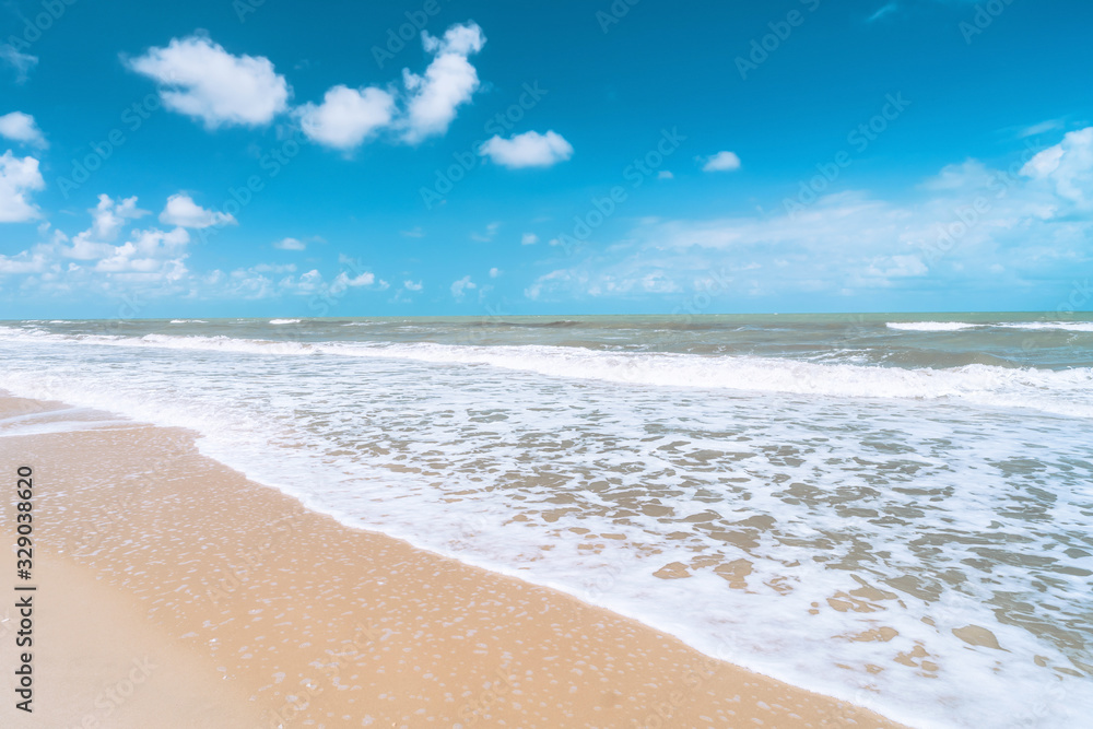 Beautiful tropical beach with blue sky and white clouds abstract texture background. Copy space of summer vacation and holiday business travel concept. Beautiful tropical beach with blue sky and white clouds abstract texture background. Copy space of summer vacation and holiday business travel concept.