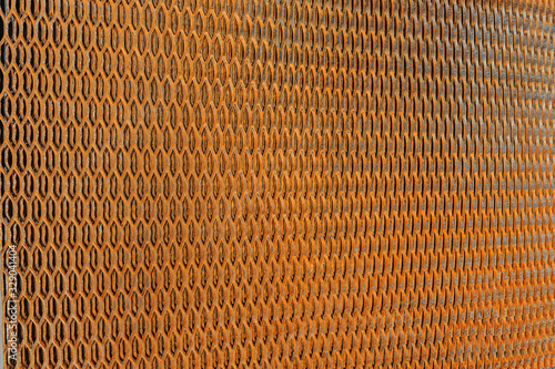 Background close up of rusty steel metal grating net texture structured design. For photo collages