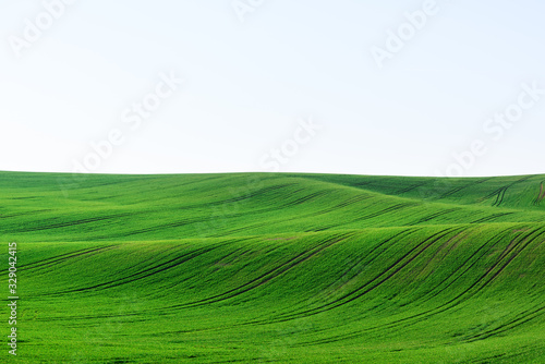 Abstract rural landscape with agricultural fields on spring hills. South Moravia region, Czech Republic