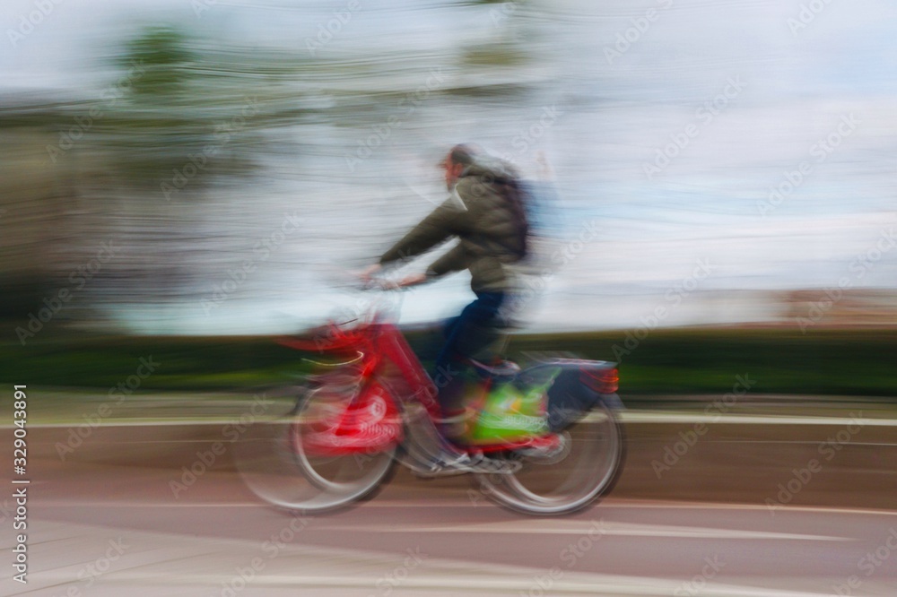 Fototapeta premium people ciclyng on the street in Bilbao city Spain, mode of transport