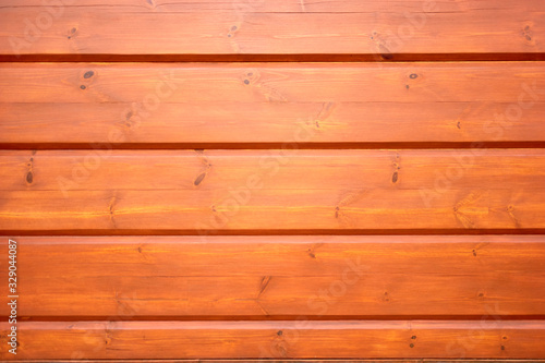 Wooden wall texture. Horizontal orange wood planks.