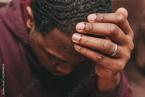 Canvastavla black african american man depicting a sad depressive state, depression concept