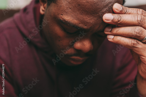 Cuadro en lienzo black african american man depicting a sad depressive state, depression concept