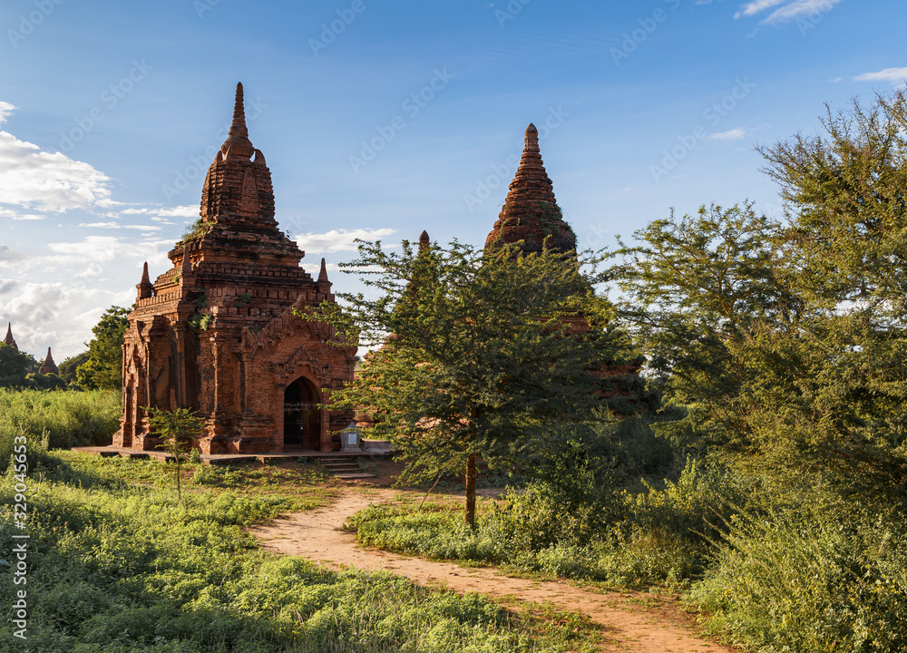 Ancient Buddhist pagodas in Bagan, Myanmar (Burma). The pathway leading to the entrance. Travel Asia.