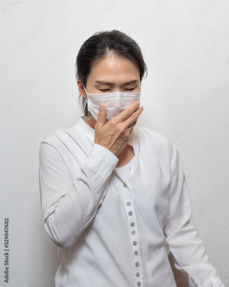 Young Asian woman wearing surgical mask prevent germs, toxic fumes,dust isolated on white background,Wuhan coronavirus (COVID-19) outbreak prevention in public area. Health care and medical concept. Young Asian woman wearing surgical mask prevent germs, toxic fumes,dust isolated on white background,Wuhan coronavirus (COVID-19) outbreak prevention in public area. Health care and medical concept.
