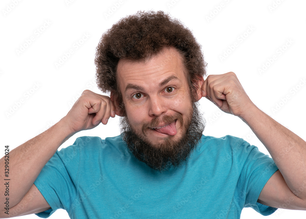 Emotional portrait of bearded man with Curly Hair, shows tongue, isolated  on white background. Caucasian male making grimace - funny silly monkey  face. Stock Photo | Adobe Stock