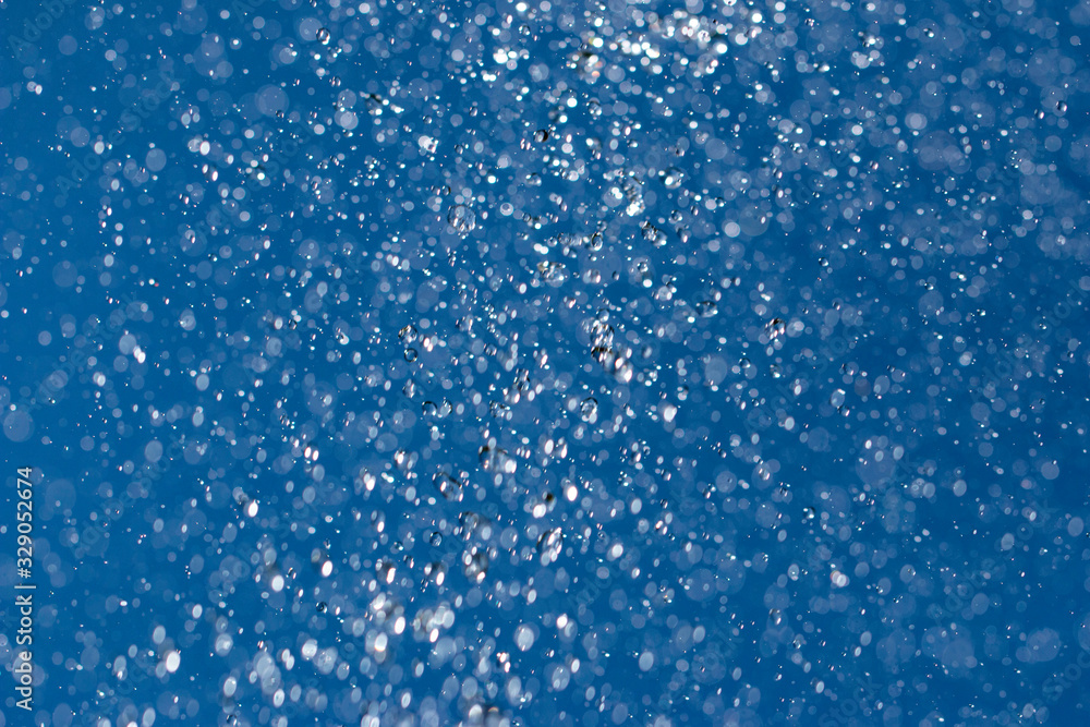 clear and fuzzy drops of water on a blue background clear and fuzzy drops of water on a blue background