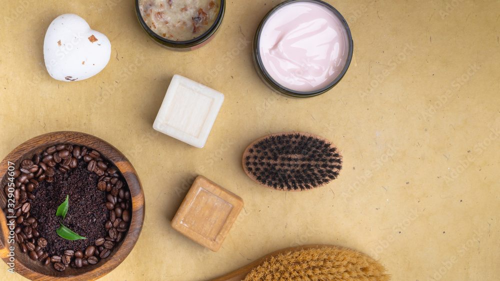 cream lotion, scrub, soap, body brush on wooden surface cream lotion, scrub, soap, body brush on wooden surface