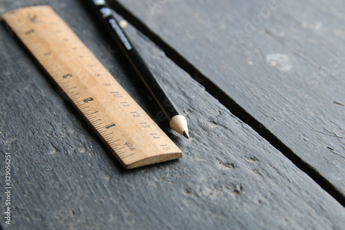 wooden ruler lies on a vintage table