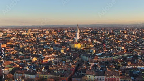 modena city centre aerial view drone fly orbit over downtown at sunset 4k