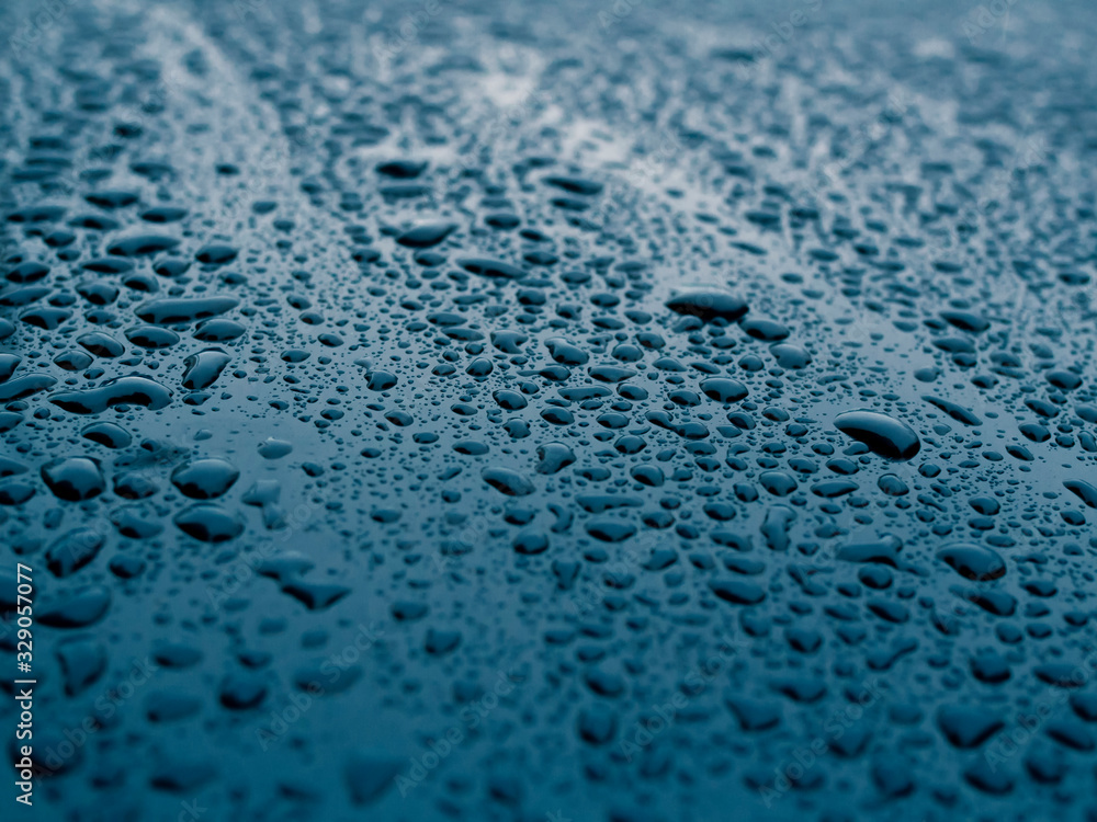 Obraz premium Blue wet, smooth surface of painted metal