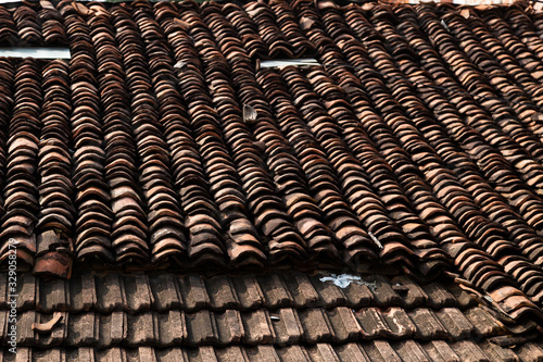 old clay roof tiles close up as background