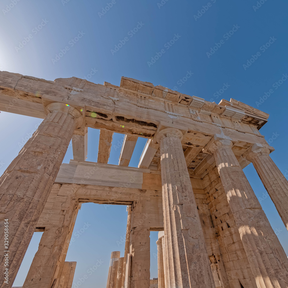 lens flare in extreme perspective of Propylea (entrance) of Athens Acropolis, Greece