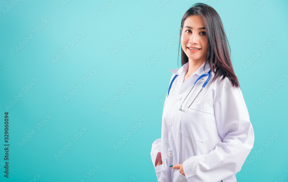 Portrait asian beautiful doctor woman smiling her standing with Hands in Pockets Portrait asian beautiful doctor woman smiling her standing with Hands in Pockets