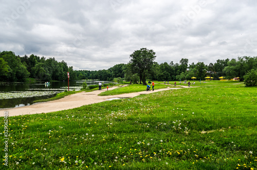 City landscape park with lawns, a lake and hiking trails, Moscow, Kuzminki Park, Russia, August 11, 2017 photo