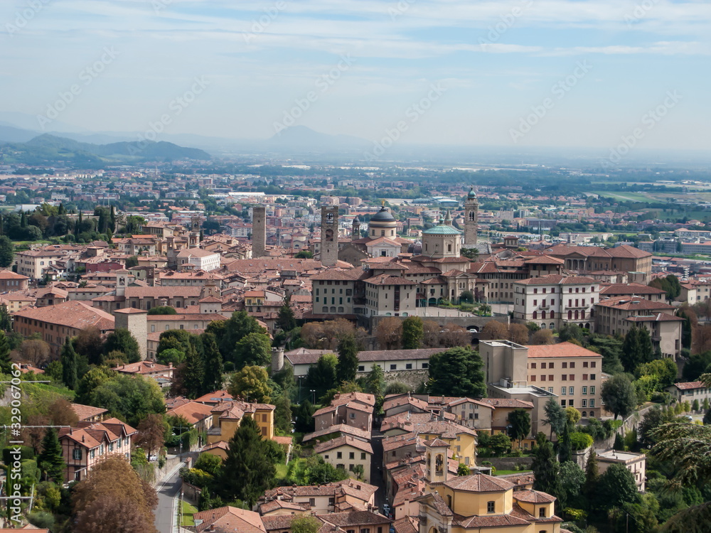 panoramic view of the old town, Apennines and the Padan plain from the hill of San Vigilio, Bergamo, Italy