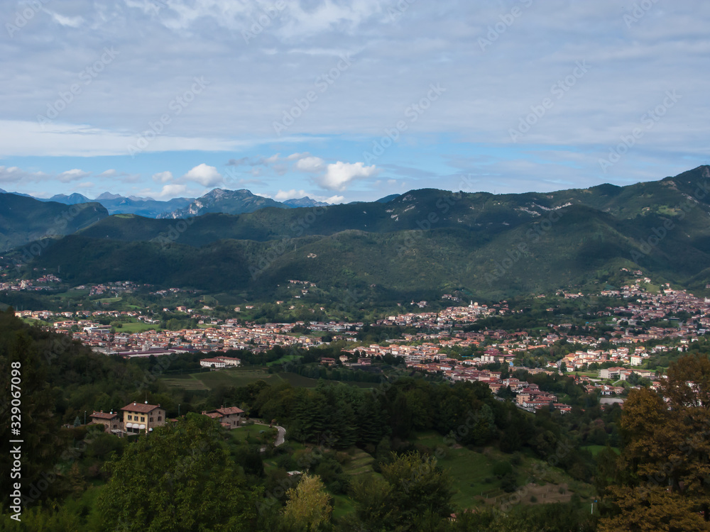 panoramic view of the city, Apennines and the Padan plain from the hill of San Vigilio, Bergamo, Italy