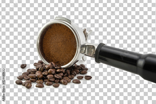 Roasted and ground coffee in porta filter holder on beans and isolated background including clipping path.