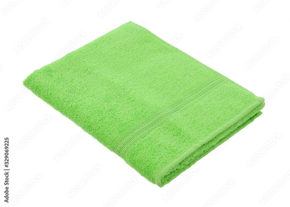 green towel lies on a white background green towel lies on a white background