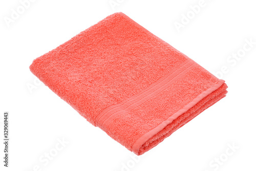 coral towel lies on a white background of isolate