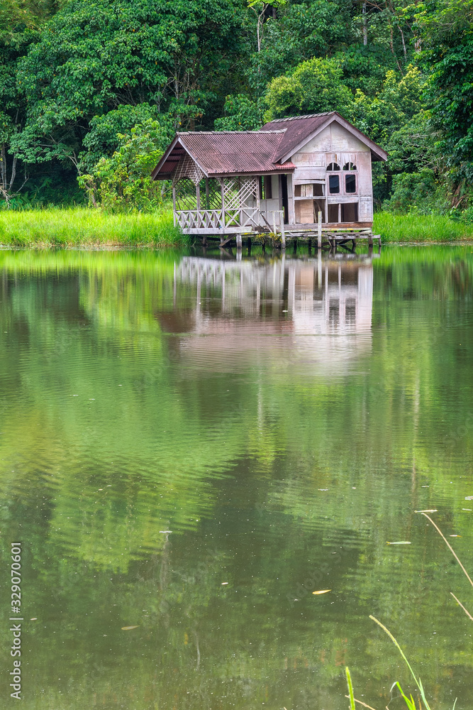 Abandoned wooden water chalet in the forest Abandoned wooden water chalet in the forest