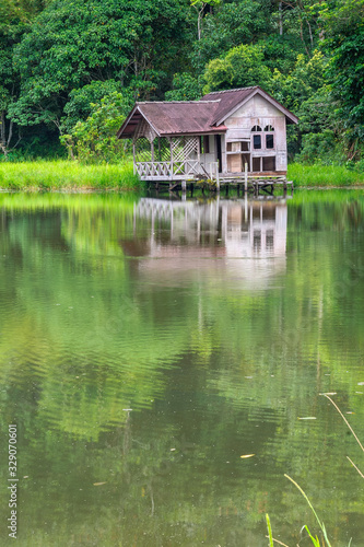 Abandoned wooden water chalet in the forest