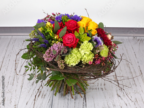 Flower arrangement with roses, lilac and anemones photo