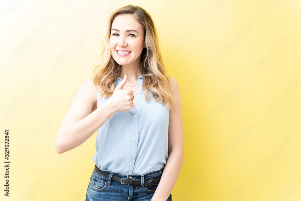 Smiling Adult Woman Showing Thumbs Up Smiling Adult Woman Showing Thumbs Up