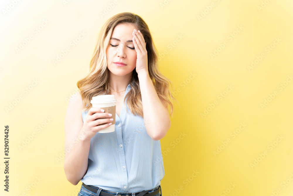 Stressed Woman With Coffee Over Colored Background Stressed Woman With Coffee Over Colored Background