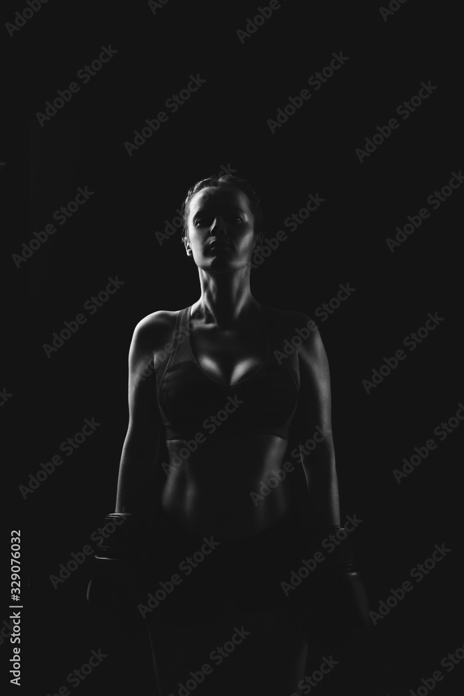 Sport. Portrait of a woman in boxing glove.